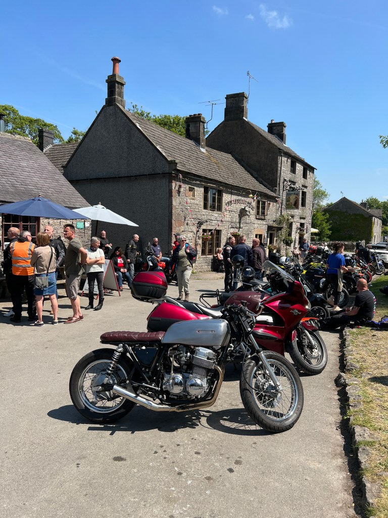 My CB750 Café Racer taking a well earned rest in Monyash at the village green.