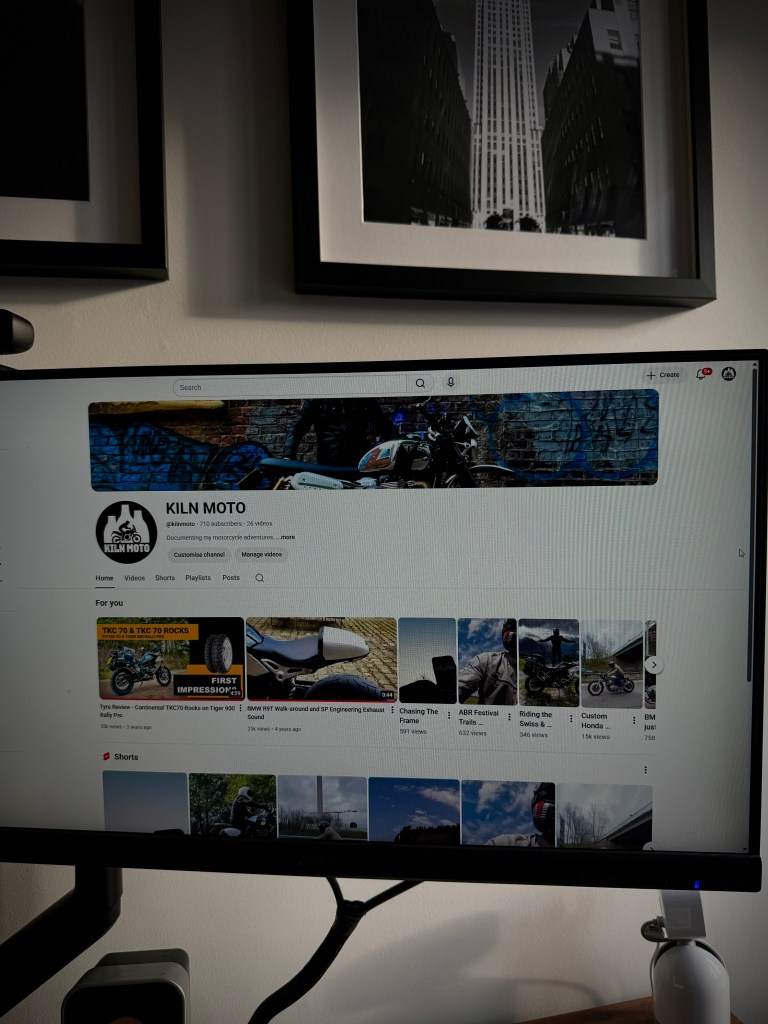 Computer monitor displaying a YouTube channel named Kiln Moto, featuring motorcycle-related content, including videos and playlists.